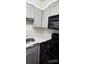 Galley kitchen featuring gray cabinets and stainless steel appliances at 2479 Peachtree Ne Rd # 902, Atlanta, GA 30305