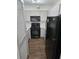 Efficient kitchen with stainless steel appliances, white cabinets, and hardwood floors at 2479 Peachtree Ne Rd # 902, Atlanta, GA 30305