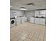 Bright laundry room with rows of modern washers and dryers for residents' convenience at 2479 Peachtree Ne Rd # 902, Atlanta, GA 30305
