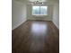 Bright and airy living room with hardwood floors and views of the cityscape at 2479 Peachtree Ne Rd # 902, Atlanta, GA 30305