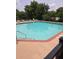 Inviting community pool with lounge chairs and trees at 2479 Peachtree Ne Rd # 902, Atlanta, GA 30305