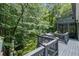 Multi-level deck with multiple seating areas and wooded views at 3648 Sope Creek Farm Se, Marietta, GA 30067