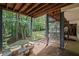 Inviting back patio with stone table and seating, offering a serene outdoor space at 3648 Sope Creek Farm Se, Marietta, GA 30067