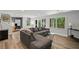 Finished basement featuring a large sectional and a desk area at 3648 Sope Creek Farm Se, Marietta, GA 30067