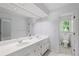 Clean bathroom with a double vanity, generous counter space, and view to backyard at 3648 Sope Creek Farm Se, Marietta, GA 30067