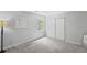Neutral bedroom features a closet and ample natural light at 3648 Sope Creek Farm Se, Marietta, GA 30067