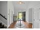Inviting foyer with hardwood floors, an open doorway leading to the outdoors, and elegant decor, providing a warm welcome at 3648 Sope Creek Farm Se, Marietta, GA 30067