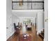 Bright foyer with hardwood floors, a staircase, and a view into the dining area, offering a welcoming entrance at 3648 Sope Creek Farm Se, Marietta, GA 30067