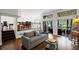 Open living room with hardwood floors, staircase, and patio access, offering a spacious and inviting layout at 3648 Sope Creek Farm Se, Marietta, GA 30067