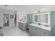 Stylish main bathroom featuring double vanities with modern fixtures and decor at 3648 Sope Creek Farm Se, Marietta, GA 30067