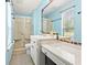 Bathroom featuring glass enclosed shower, single sink, and modern fixtures at 423 Mephisto Cir, Lawrenceville, GA 30046