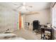 Bedroom featuring wallpaper, ceiling fan, closet, and modern fixtures at 423 Mephisto Cir, Lawrenceville, GA 30046