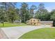 Two-story house with attached two-car garage on a large lot with a driveway at 423 Mephisto Cir, Lawrenceville, GA 30046