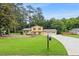 Beautifully landscaped two-story home with an attached two-car garage, set on a lush green lawn at 423 Mephisto Cir, Lawrenceville, GA 30046