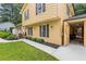 Charming home exterior with a walkway, complemented by well-maintained landscaping and decorative details at 423 Mephisto Cir, Lawrenceville, GA 30046