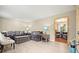 Bright living room featuring contemporary decor, comfortable seating, and modern flooring at 423 Mephisto Cir, Lawrenceville, GA 30046