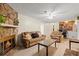 Cozy living room with a stone fireplace, plush seating, and an open view to the upper floor at 423 Mephisto Cir, Lawrenceville, GA 30046
