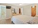Bedroom featuring neutral paint, ceiling fan, and ensuite bath at 423 Mephisto Cir, Lawrenceville, GA 30046