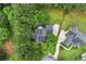 Aerial view of home and neighborhood featuring mature trees and landscaping at 6655 Manchester Pl, Cumming, GA 30040