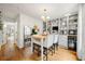 Bright dining area featuring built-in shelves, a breakfast bar, and a light-filled dining space at 6655 Manchester Pl, Cumming, GA 30040