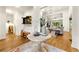 Grand entryway featuring hardwood floors, elegant table decor, and open view to the living spaces at 6655 Manchester Pl, Cumming, GA 30040