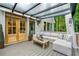 Relaxing patio with comfortable seating, wood floors, and natural light at 6655 Manchester Pl, Cumming, GA 30040