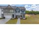 Inviting new construction home with manicured lawn and sidewalk leading to the front door at 1028 Merritt Dr # 15, Villa Rica, GA 30180