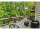 Cozy back deck surrounded by lush greenery, perfect for outdoor entertaining and relaxation at 1720 Little Willeo Rd, Marietta, GA 30068