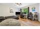 Fun game room with a large bed, multiple gaming monitors, a popcorn machine, and dark wood-look floors at 1720 Little Willeo Rd, Marietta, GA 30068