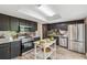 Beautiful kitchen with black cabinets, stainless steel appliances and ample countertop space at 1720 Little Willeo Rd, Marietta, GA 30068