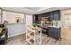Bright kitchen with black cabinets, stainless steel appliances and an island at 1720 Little Willeo Rd, Marietta, GA 30068