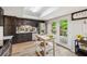 Kitchen with black cabinets, stainless steel appliances, island and access to the deck at 1720 Little Willeo Rd, Marietta, GA 30068