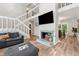 Living room with a fireplace, stairs, and view of the dining room at 1720 Little Willeo Rd, Marietta, GA 30068