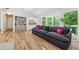 Spacious living room featuring hardwood floors, ample natural light, and built-in shelving with a bar area at 1720 Little Willeo Rd, Marietta, GA 30068