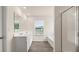 Bathroom featuring a double sink vanity, soaking tub, separate shower, and natural light at 291 Sandy Oak Dr, Loganville, GA 30052