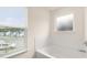 Corner soaking tub with tile backsplash and a window with neighborhood views at 291 Sandy Oak Dr, Loganville, GA 30052
