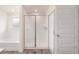 New bathroom featuring a glass shower with white subway tile and a soaking tub at 291 Sandy Oak Dr, Loganville, GA 30052