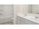 Bright bathroom with double sinks, white cabinets, and a tub/shower combination at 291 Sandy Oak Dr, Loganville, GA 30052