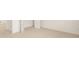 Open view of the bedroom showcasing neutral carpet and multiple doors at 291 Sandy Oak Dr, Loganville, GA 30052