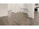 The stylish kitchen offers hardwood floors, an island, and stainless steel appliances at 291 Sandy Oak Dr, Loganville, GA 30052