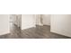 Spacious living room with hardwood floors leading to the kitchen and other living areas at 291 Sandy Oak Dr, Loganville, GA 30052