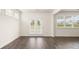 Bright living room with a glass door and multiple windows bringing in ample natural light at 291 Sandy Oak Dr, Loganville, GA 30052
