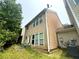 Back of house showing siding, large windows and patio at 1560 Park Grove Dr, Lawrenceville, GA 30046