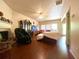 Bright living room features hardwood floors, a ceiling fan, fireplace, and a large window at 1560 Park Grove Dr, Lawrenceville, GA 30046