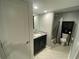 Bathroom features a vanity with granite countertops, a large mirror, and tile floors at 3117 Colonial Way # G, Atlanta, GA 30341