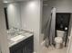 Bathroom features a vanity with granite countertops, a large mirror, and tile floors at 3117 Colonial Way # G, Atlanta, GA 30341