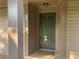 View of the unit's front door featuring a traditional design, secure entry, and neutral color scheme at 3117 Colonial Way # G, Atlanta, GA 30341