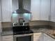 Modern kitchen with stainless steel appliances, granite countertops, and stylish cabinetry at 3117 Colonial Way # G, Atlanta, GA 30341