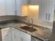 Modern kitchen with stainless steel appliances, granite countertops, and white shaker cabinets at 3117 Colonial Way # G, Atlanta, GA 30341