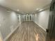 Spacious living room with hardwood floors, neutral paint, and plenty of natural light at 3117 Colonial Way # G, Atlanta, GA 30341